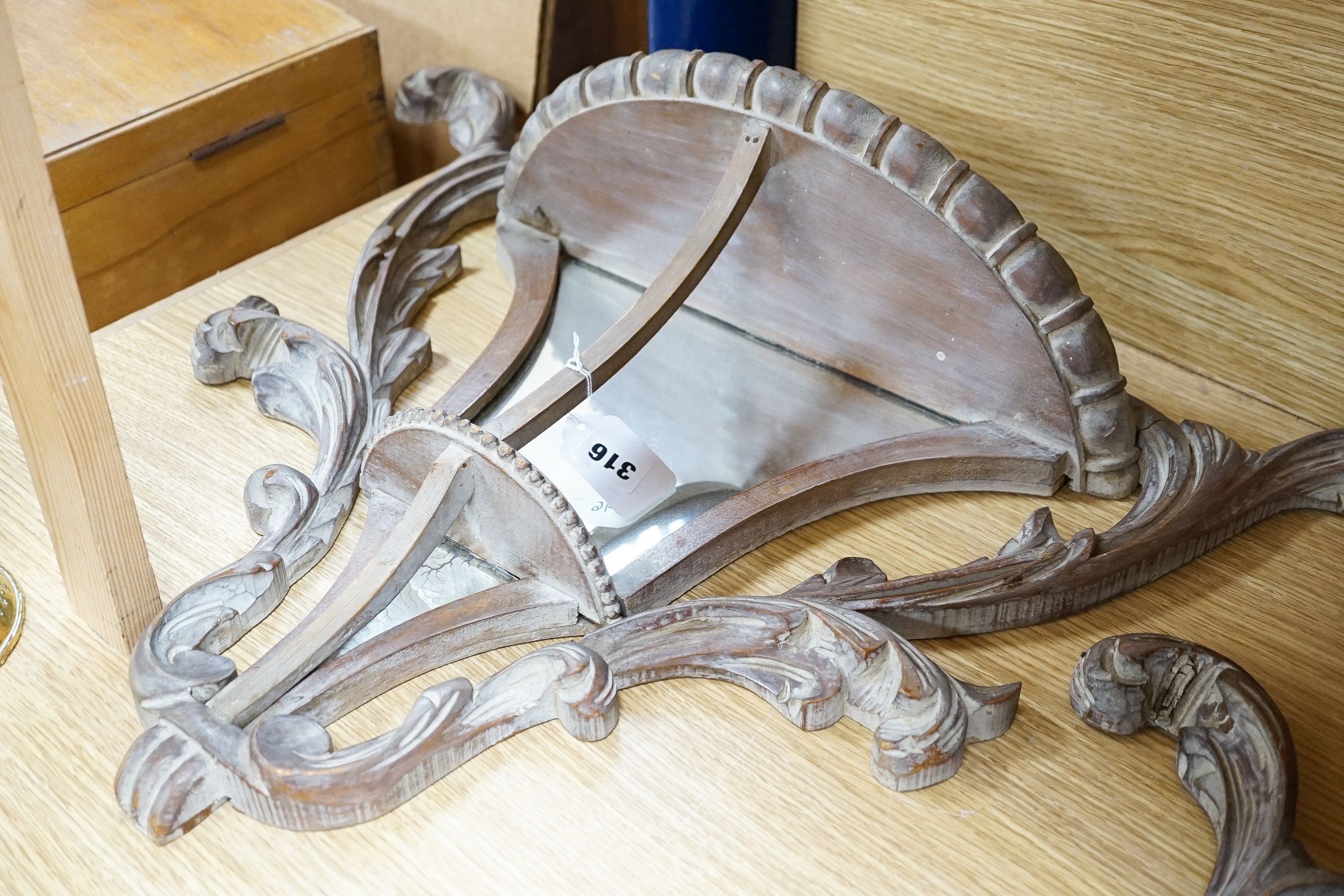 A pair of early 20th century mirror backed carved beech wall brackets 50cm